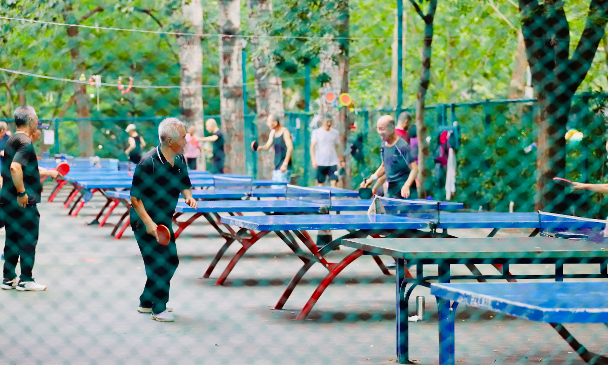 Elderly residents play table tennis at a park in Beijing on September 1, 2025. Photo: IC