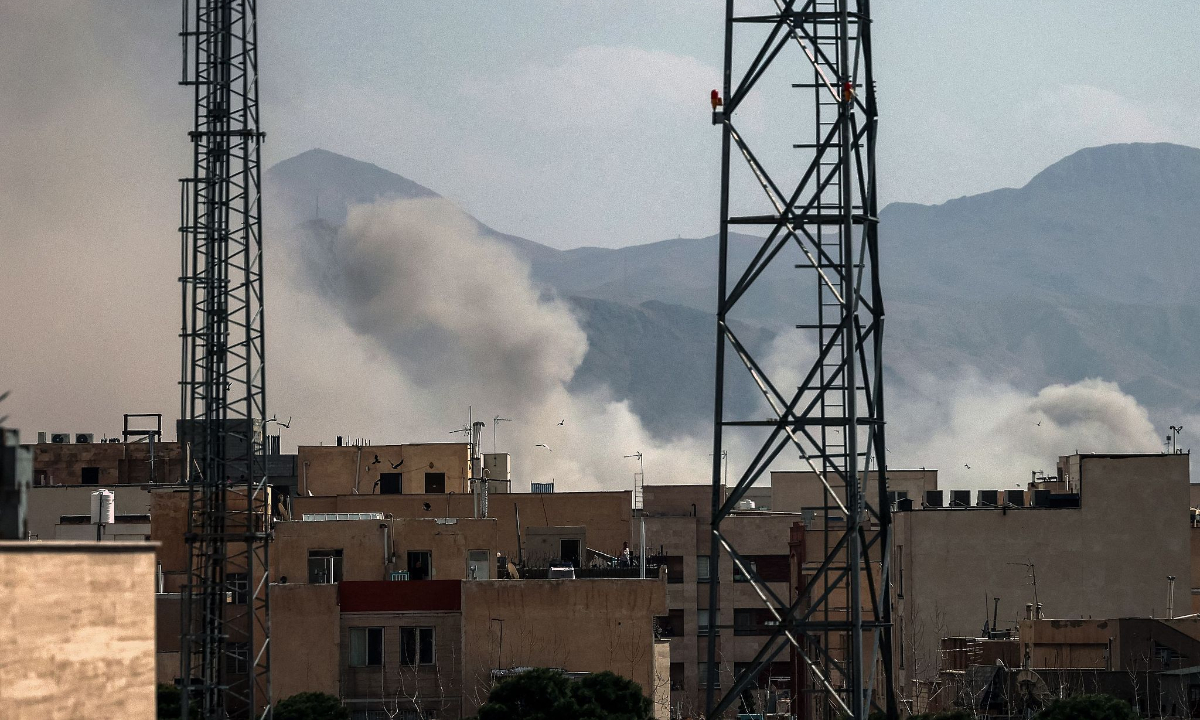 A plume of smoke rises following a reported explosion in Tehran on February 28, 2026. Photo: VCG