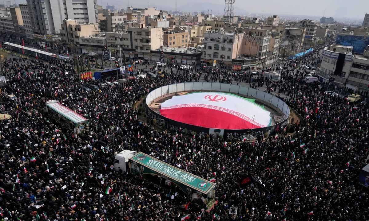 Mourners attend the funeral procession for senior Iranian military officials and some civilians killed during the US-Israel strikes, in Tehran on March 11, 2026. Photo: VCG