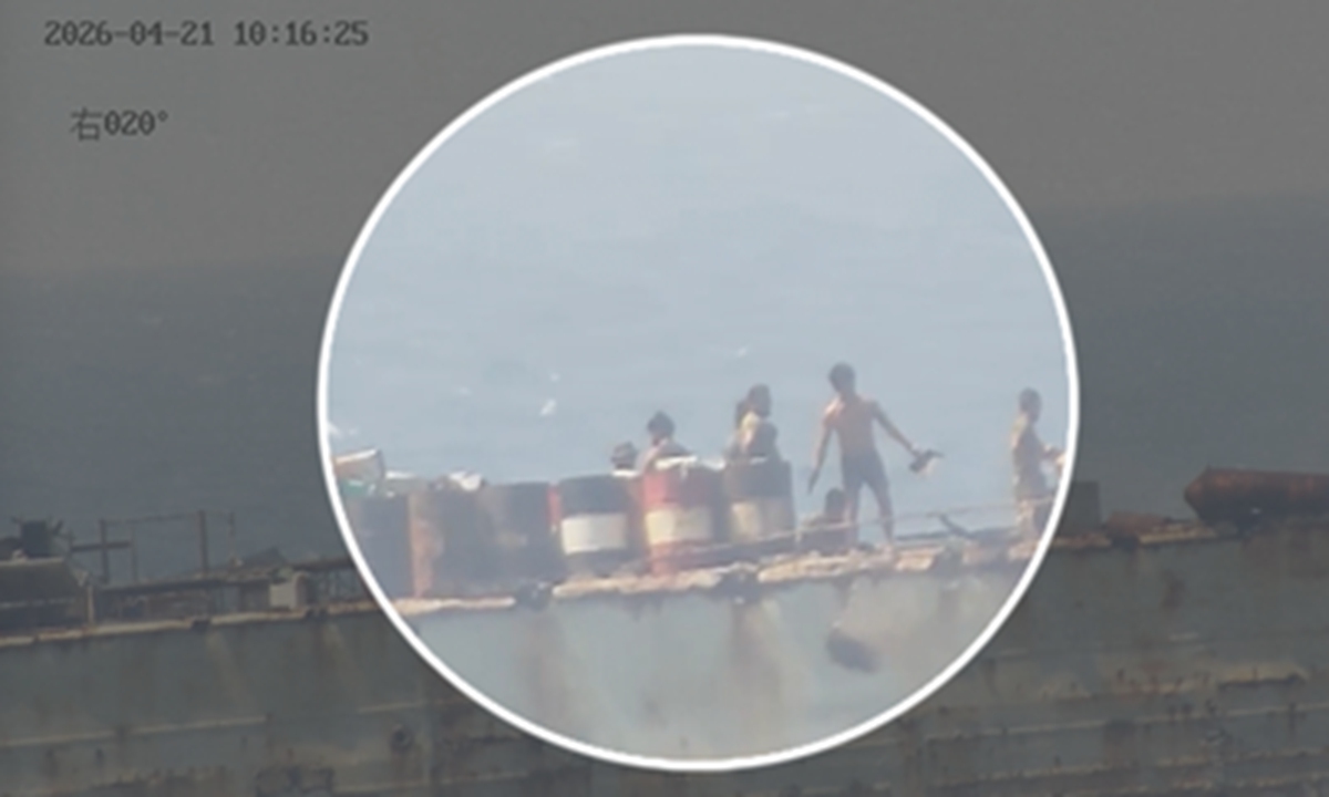 Video footage shows Philippine personnel on illegally grounded warship BRP Sierra Madre are burning garbage while disposing of waste into the water around Ren