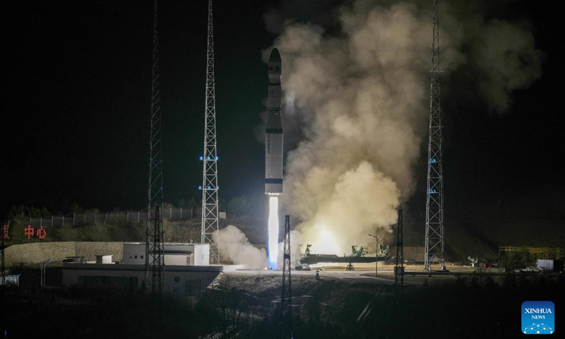 A Long March-6 carrier rocket carrying a Pakistani satellite blasts off from the Taiyuan Satellite Launch Center in north China