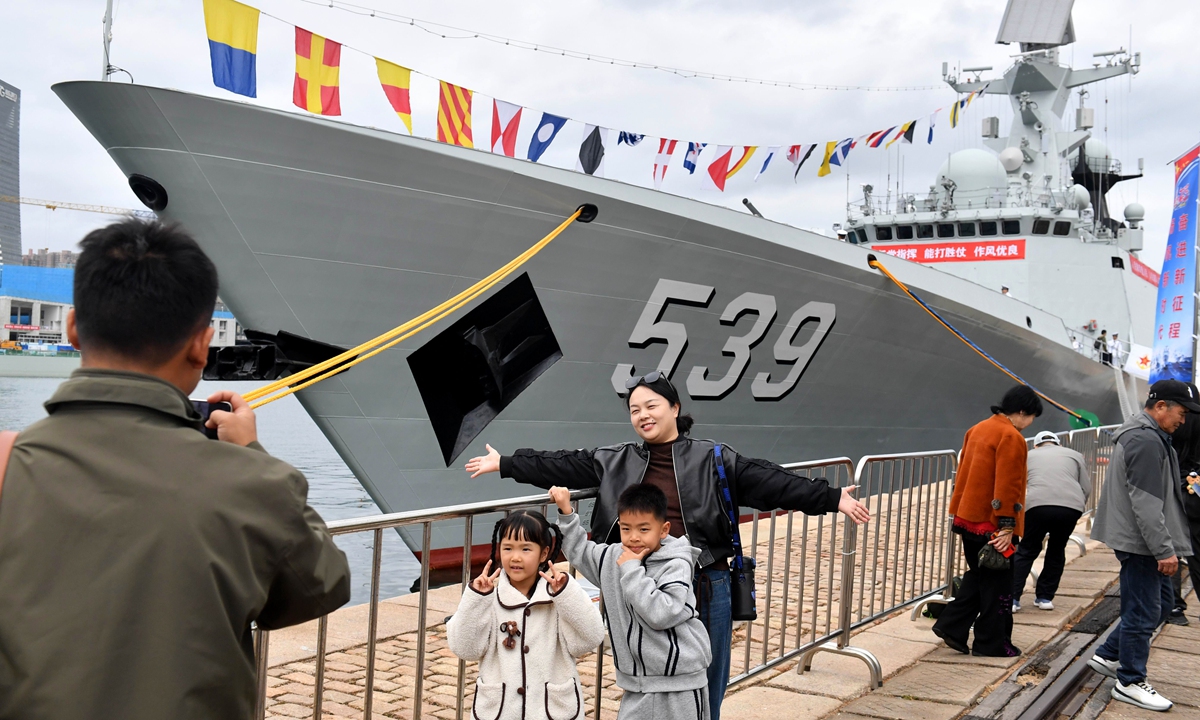 Visitors attend the ship open-day event of the Northern Theater Command Navy in Qingdao, East China