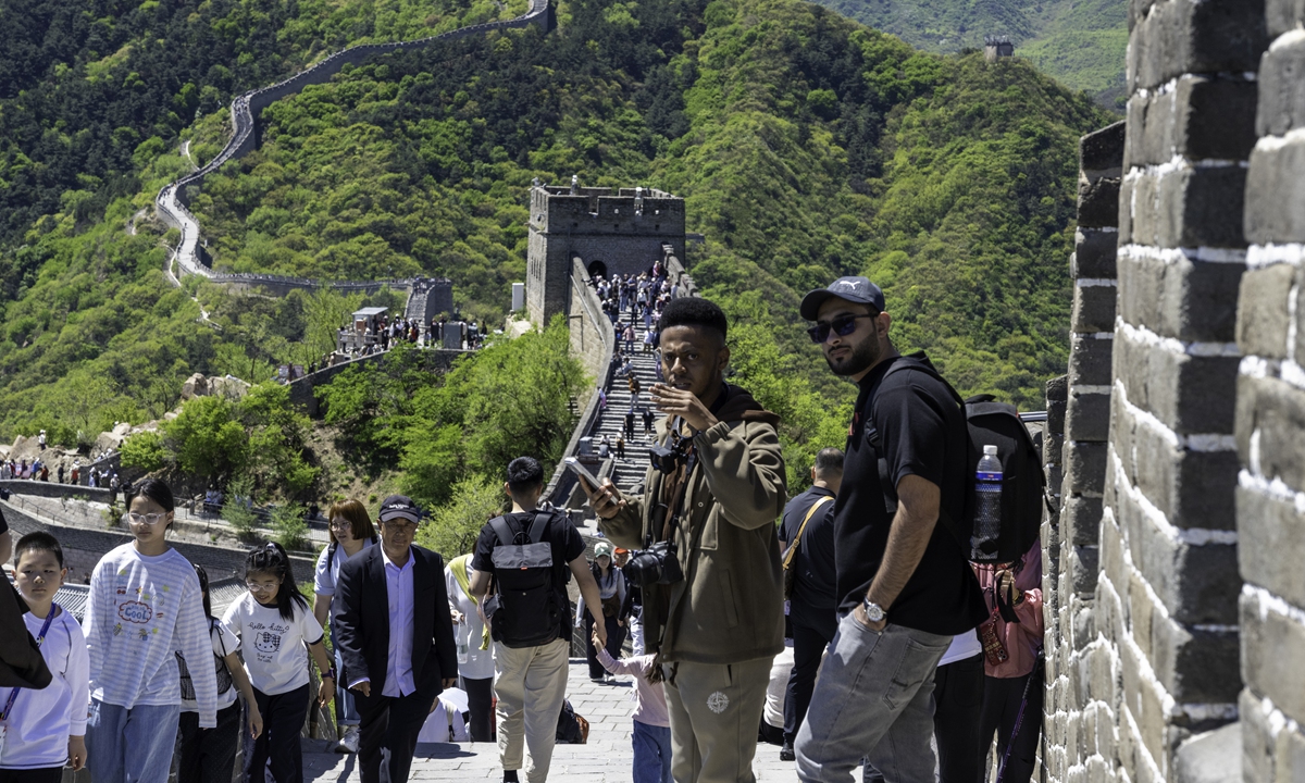 Foreign tourists visit Badaling Great Wall in Beijing on April 29, 2026, ahead of China