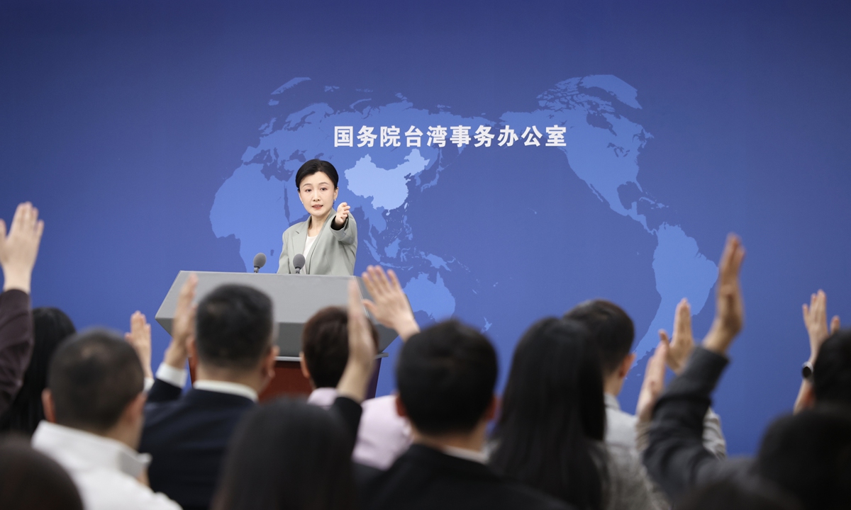 Taiwan Affairs Office spokesperson Zhang Han takes reporters