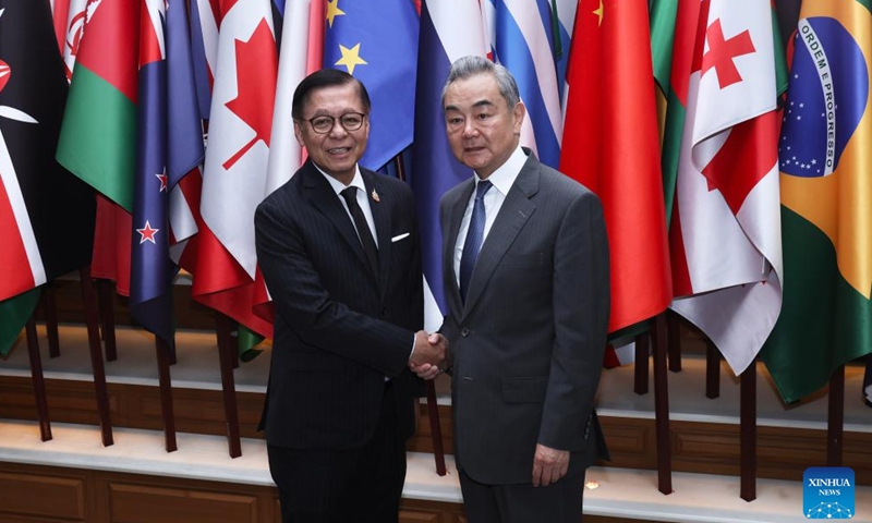 Chinese Foreign Minister Wang Yi, also a member of the Political Bureau of the Communist Party of China Central Committee, together with Sihasak Phuangketkeow, Thailand