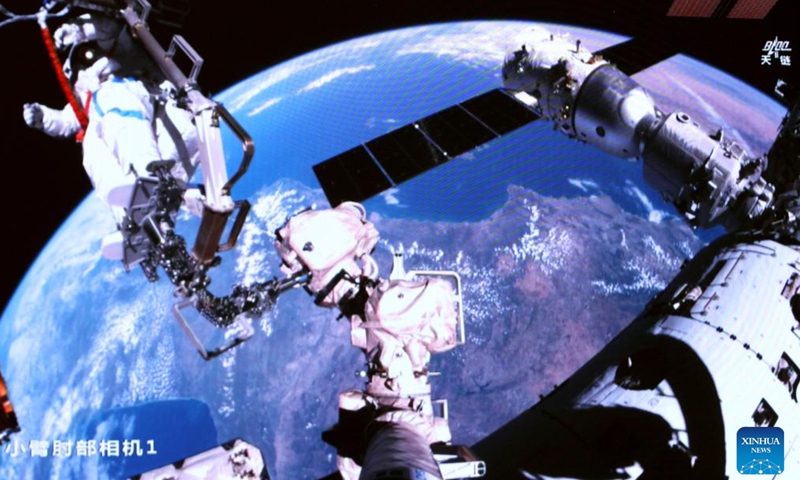 This screen image captured at Beijing Aerospace Control Center on April 16, 2026 shows Shenzhou-21 taikonaut Wu Fei performing extravehicular activities (EVAs) outside China