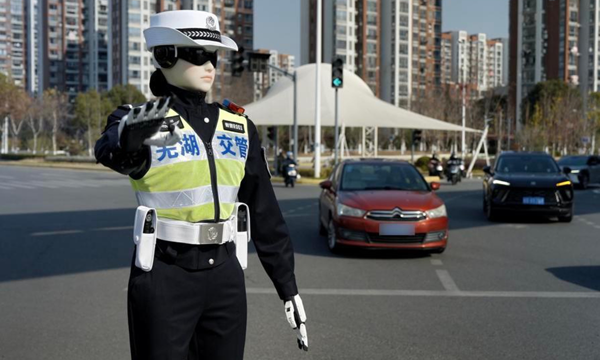 A robot officer with badge number Intelligent Police Unit R001 is seen on a road in Wuhu, east China