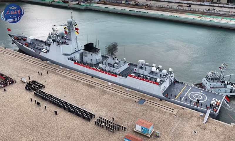 The type 052DL destroyer Tangshan (Hull 122) returns to a naval port in Qingdao, East China